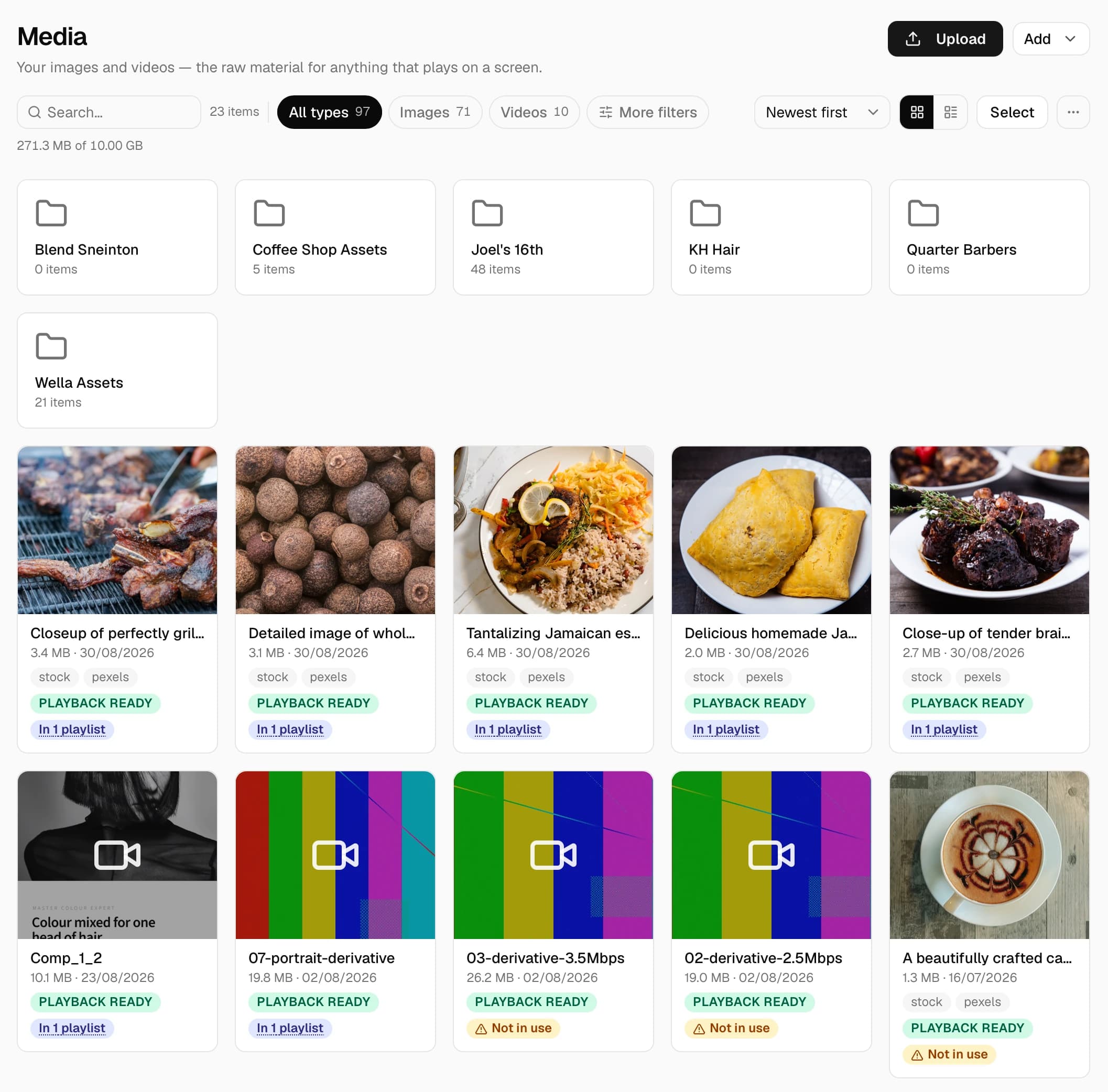 The Synk media library: folders per venue, uploaded images and videos, each marked playback ready and showing which playlists use it.